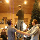 Dudes bang heads while catching friend
