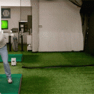 Golfer hitting an apple off a man's head