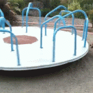 Corgi jumps on spinning carousel