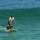 Surfing with two dogs