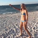 Girl offers a chip to a seagull