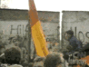 1236166696_the_fall_of_the_berlin_wall_-_the_cool_aid_guy.gif