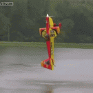 RC plane hovers vertically over water