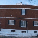 Pouring boiling water from building during cold