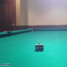 Pool trick shot with a coin