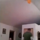 Dad and toddler retrieve balloon from the ceiling