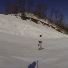 Snowboarder almost hits skier in the head