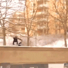 Snowboarder acidentally falls off building like a boss