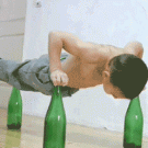 Worlds strongest kid Giuliano Sroe doing push-ups on bottles