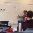 Teacher whipes cat off whiteboard