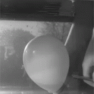 Slo-mo balloon popping under water