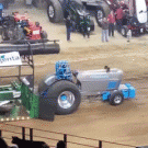 Tractor loses front wheels during pull
