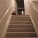 Baby takes the stairs to get to his bottle