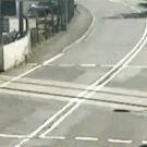 Car passes in front of train