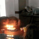 Kid blows out birthday candles with balloon