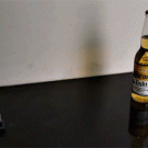 Mini cannon blows up beer bottle
