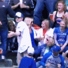 Baseball fan spills beer while throwing ball