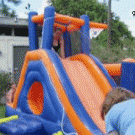 Girl on inflatable slide fail