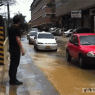 Guy takes cab to cross puddle