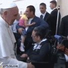 Pope Francis exorcises guy in wheelchair