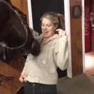 Horse plays with girl's zipper