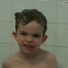 Kid blows soap bubble out mouth