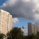 Airplane flies very close to apartment buildings