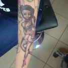 Creative pin-up girl arm tattoo