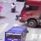 Woman on bicycle survives after being run over by truck
