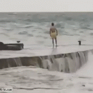 Kid jumps in huge wave
