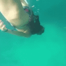Snorkeling girl bangs head