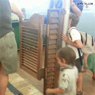 Kid gets hit by swinging doors