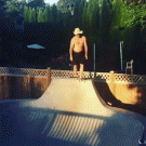 Skateboarder jumps into pool