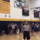 Referee removes ball from behind rim