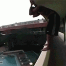 Guy jumps in swimming pool off balcony