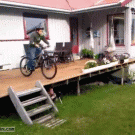 Kid faceplants with bike off porch
