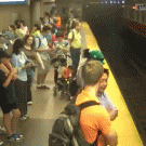 Woman carrying kid has accident at subway station