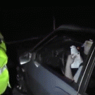 Russian policeman smashes car window