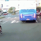 Schoolgirl walking across the street almost gets hit by bus