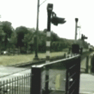 Car crossing train tracks