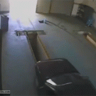 Man falls into hole while pushing car out of service garage