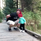 Dad catches daughter falling off bridge