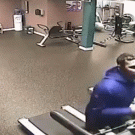Guy removes shirt while riding treadmill