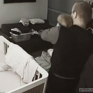 Father catches baby falling off bed